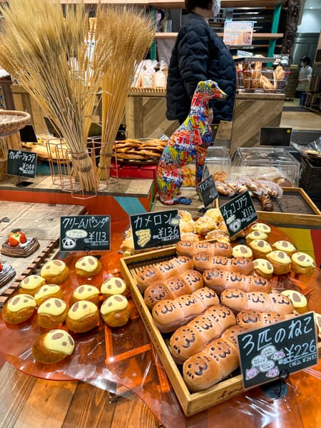 Bakery with bread spread out on a counter.