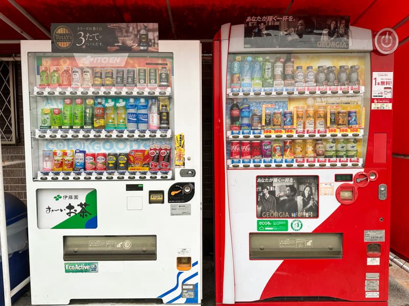 Vending machines in Japan selling cold (blue labeled) and hot (red labeled) drinks.